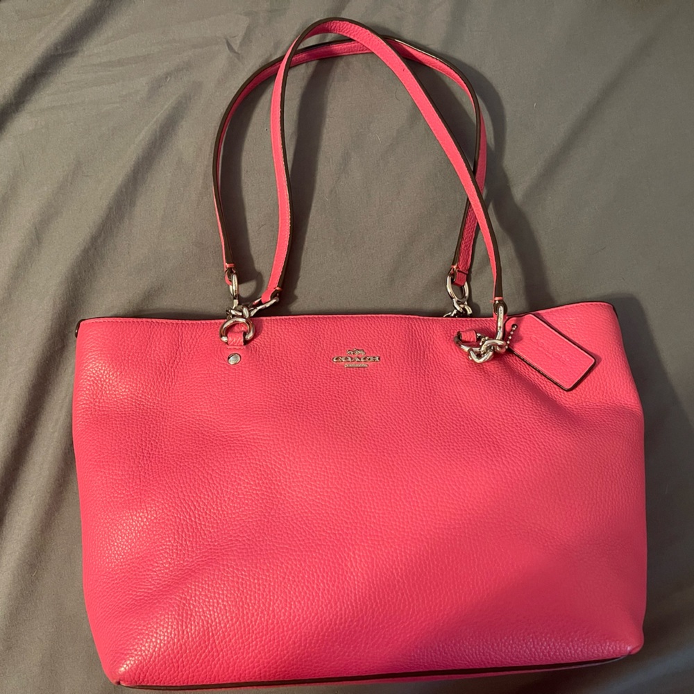 Bright pink leather Coach purse w/silver accents. Excellent condition. 14”Wx9”H